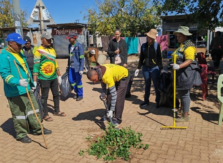 volunteers cleaning rank