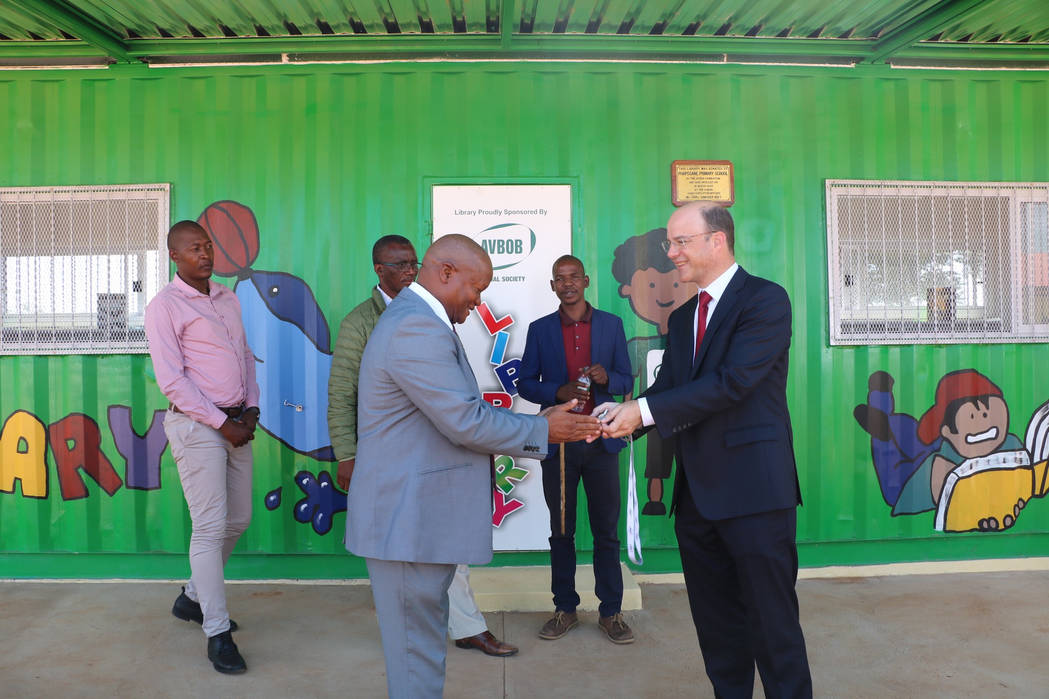 Handing of container library to the Principal of Phaposane Primary Mr Tebatso Leradile